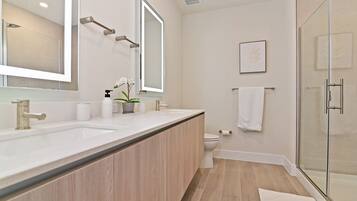 Shower, hair dryer, towels, soap