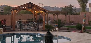 Outdoor dining - Stunning lg home with backyard Oasis with pool & hot tub. 4000 sqft on 1/3 acre. (Buckeye)