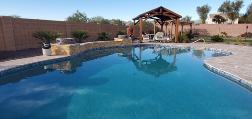 Stunning lg home with backyard Oasis with pool & hot tub. 4000 sqft on 1/3 acre.