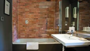 Combined shower/bathtub, hair dryer, towels, soap