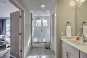 Shower, hair dryer, towels, shampoo