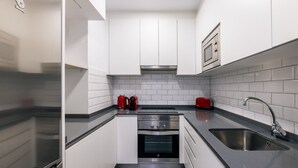 Coffee/tea maker, fridge, microwave, oven