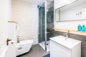 Shower, hair dryer, towels, soap