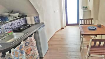 Fridge, stovetop, coffee/tea maker, cookware/dishes/utensils