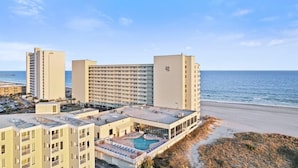 A hotel with a rooftop pool, beachfront location, and multiple buildings. - New Direct Ocean View, Exclusive Sand Beach Club! (Myrtle Beach)