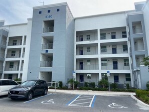 A multi-story parking garage with a building labeled 3180.
