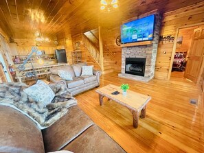 Smart TV, fireplace, books, printers