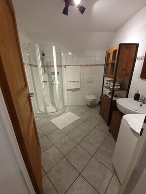Shower, hair dryer, towels, soap