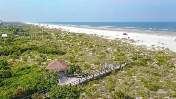Situated on the beach, this single-story structure offers a serene coastal view.