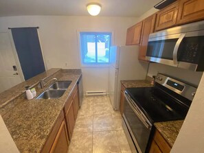 Fridge, microwave, oven, stovetop - Mountain condo one block from Steamboat Gondola (Steamboat Springs)