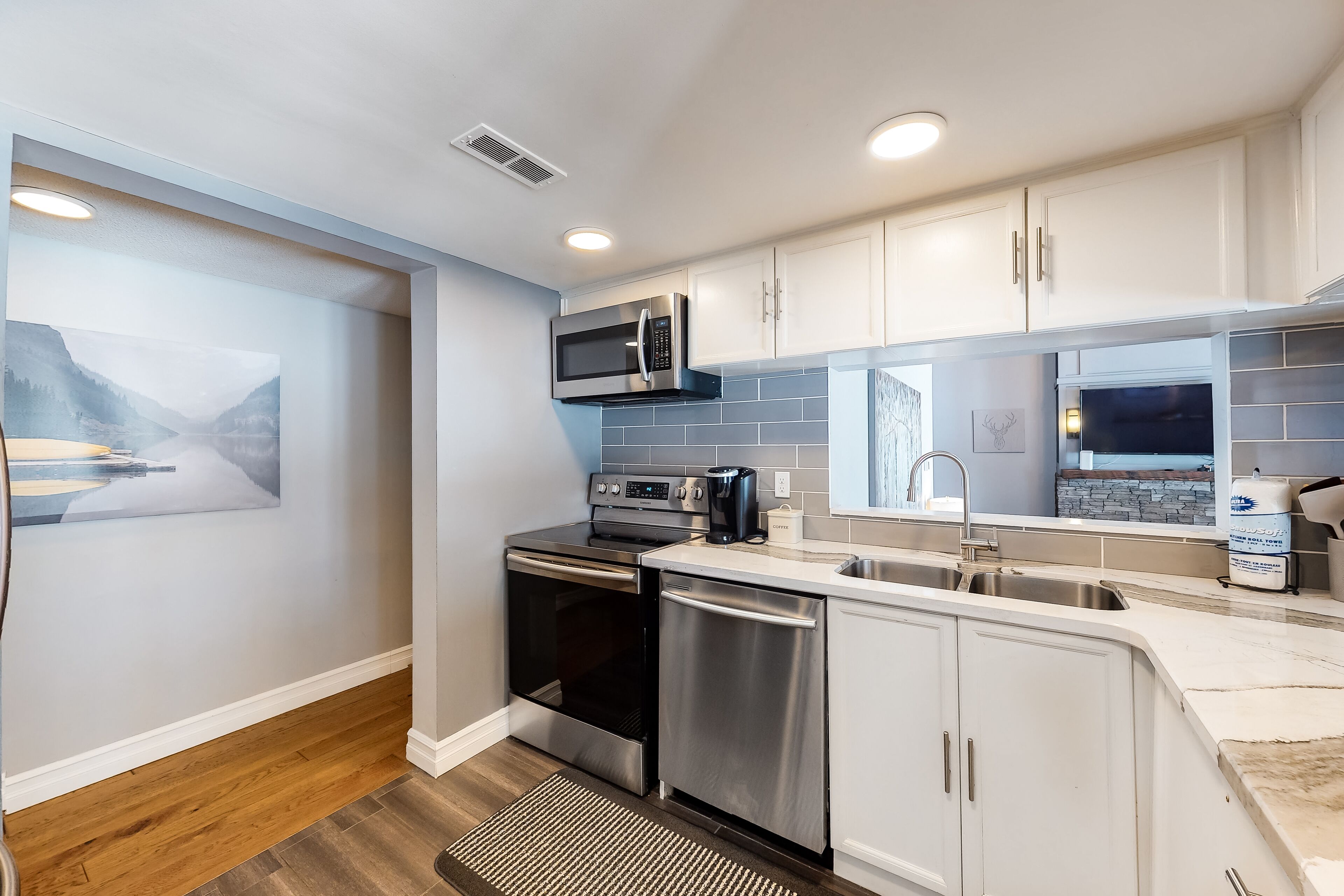 Updated condo with gas fireplace, private sauna, WiFi, central A/C, & W/D