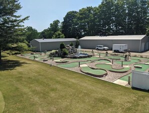 Enjoy a round of golf on this well-maintained course with water hazards and sand traps.