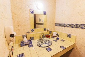 Shower, rainfall showerhead, hair dryer, towels