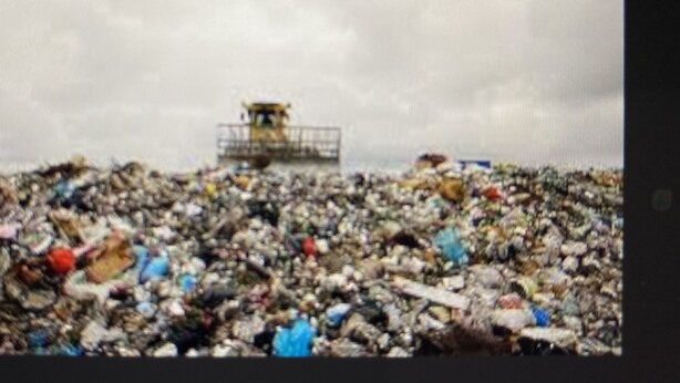 A large landfill with a bulldozer in the background. - THE HOUSE IS NOT AVAILABLE (Oaxtepec)