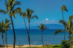A beach with palm trees and a clear view of the ocean. - Maui Sunset B102 - Aloha Tai 2, Beachfront Resort Condo, Ground floor, 1B/2BA, Sleep5 (Kihei)