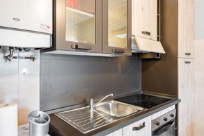 Fridge, stovetop, toaster, cookware/dishes/utensils