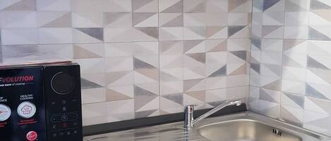 Fridge, microwave, stovetop, coffee/tea maker