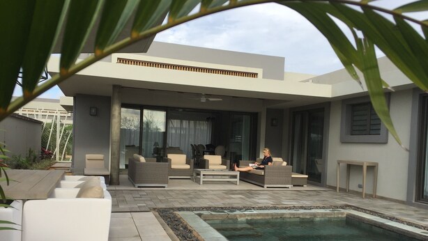 A modern outdoor living area with a pool, comfortable seating, and a covered patio. - VILLA LUXURY 220 m2 private pool Royal Park secure quiet (Moka)