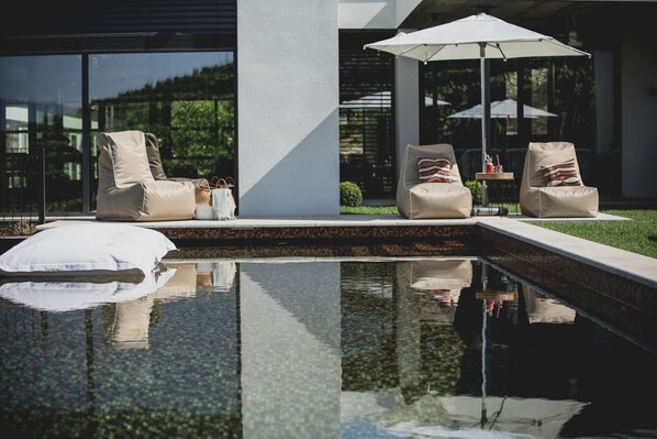 Seasonal outdoor pool, pool umbrellas, sun loungers