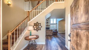 A wooden staircase with a white railing leading to a landing. - CL 1181 Cypress Ridge (Canyon Lake)