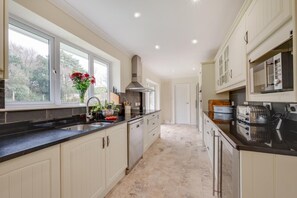 Oven, dishwasher, high chair, cookware/dishes/utensils