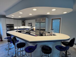 Fridge, microwave, oven, stovetop - Large Custom Home with firetable, river access, Smart TV's, yard games and more (Rockford)