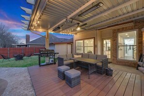Take the conversation outside to the shaded lounge beside the pool. - Glamorous 4BR/2.5B Home with Pool, Game Room & Fire Pit (Mesquite)
