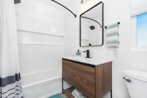 Combined shower/tub, hair dryer, towels, toilet paper