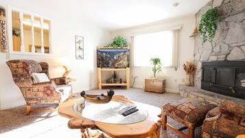 House | Living room | 46-inch LCD TV with satellite channels, TV, DVD player