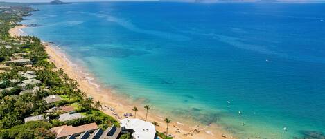 On the beach, sun loungers, beach towels
