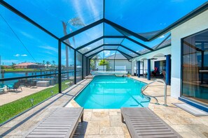Outdoor pool, a heated pool - Southern Exposure-Sun ALL Day! Lanai, Heated Pool, Waterfront, Dock Area & BBQ! (Cape Coral)