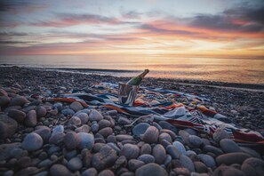 On the beach, sun-loungers, beach towels