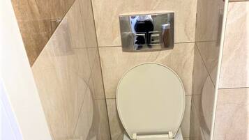 Shower, rainfall showerhead, towels, soap