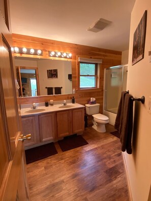 Bathtub, hair dryer, towels, soap