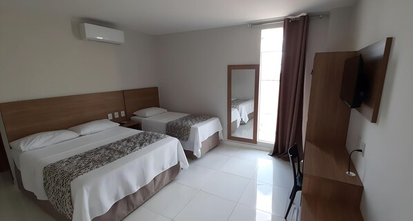 Deluxe Triple Room | Hypo-allergenic bedding, individually furnished, desk, laptop workspace