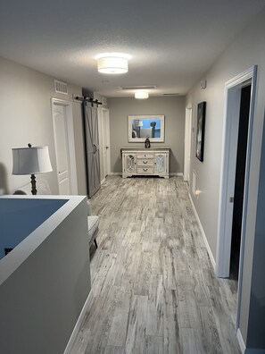 Enter a serene bathroom area with a toilet, sink, and mirror.