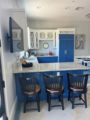 Fridge, microwave, stovetop, coffee/tea maker