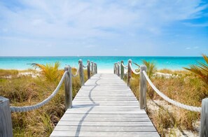 On the beach, sun-loungers, beach towels - 5 BEDROOMS across TWO PENTHOUSES -  BEACHFRONT GRACE BAY - SUMMER SPECIAL! (Grace Bay)