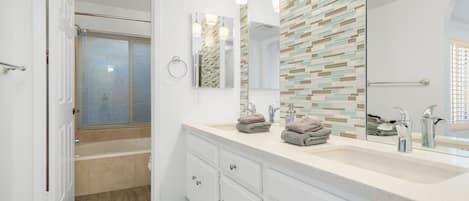 Combined shower/bathtub, hair dryer, towels, soap