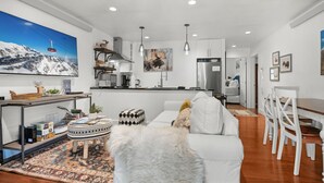 A modern apartment with a kitchen, dining area, and living room. - RMR: Spruces 13 - The Elks Condo in The Aspens (Wilson)