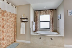 Combined shower/tub, hair dryer, towels, toilet paper