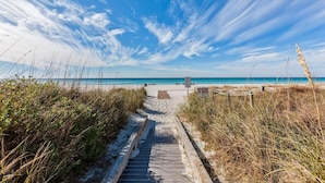 A beach path leading to the ocean with a 'No Glass on Beach' sign. - Remodeled! Beachfront Wraparound Balcony Edgewater (Panama City Beach)