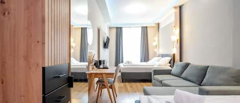 Premium bedding, down duvets, free minibar items, in-room safe