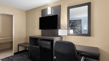 Desk, laptop workspace, blackout drapes, iron/ironing board