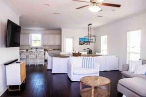 Relax in this stylish living area with a sofa, coffee table, and flat-screen TV.