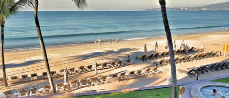 On the beach, sun-loungers, beach towels