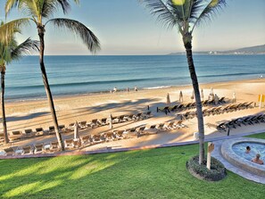 On the beach, sun loungers, beach towels
