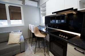 Fridge, highchair, cookware/dishes/utensils, dining tables - Design apartmanet in Magheru (București)