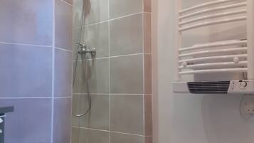 Shower, hair dryer, towels, toilet paper