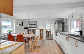 Fridge, stovetop, dishwasher, coffee/tea maker